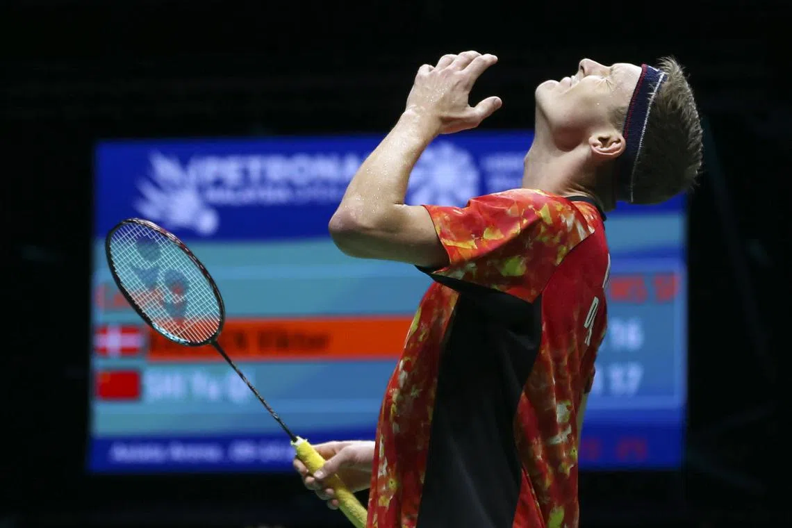 Denmark's Viktor Axelsen reacts as he plays against China's Shi Yuqi.