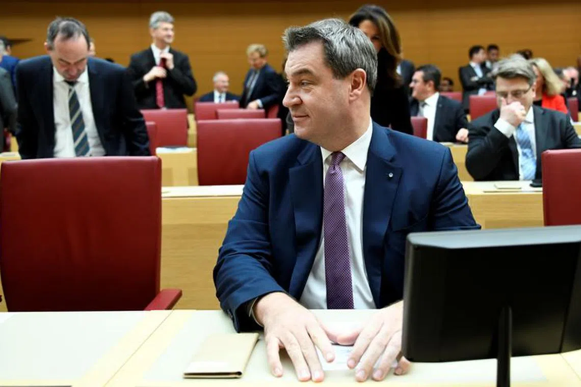 Christian Social Union (CSU) State Prime Minister Markus Soeder and party leader of the Free Voters (\"Freie Waehler\") Hubert Aiwanger attend a session of the Bavarian state parliament in Munich, Germany, November 6, 2018.     REUTERS/Andreas Gebert/File photo