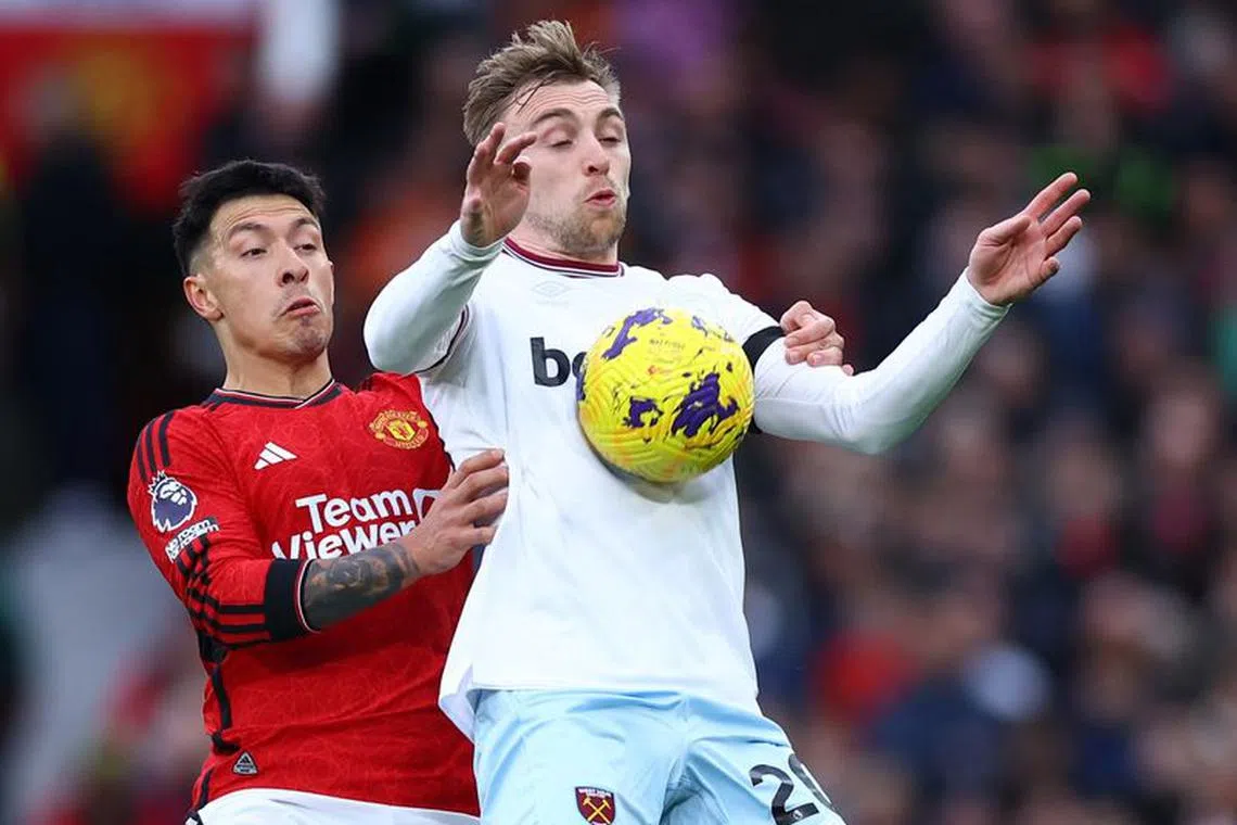 Soccer Football - Premier League - Manchester United v West Ham United - Old Trafford, Manchester, Britain - February 4, 2024 Manchester United's Lisandro Martinez in action with West Ham United's Jarrod Bowen REUTERS/Carl Recine