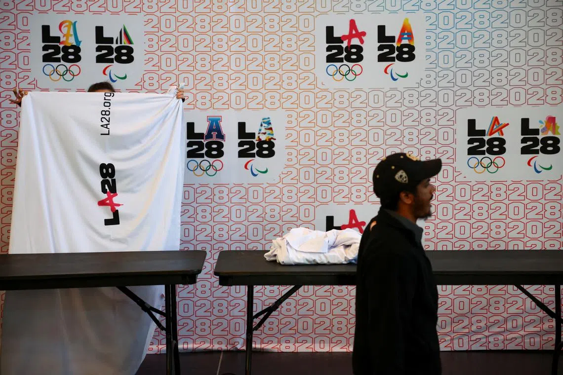 Workers pack up a space used for a press conference held by the International Olympic Committee Coordination Commission for the Los Angeles 2028 Olympic and Paralympic Games at UCLA, Los Angeles, California, U.S., November 14, 2024. REUTERS/Daniel Cole