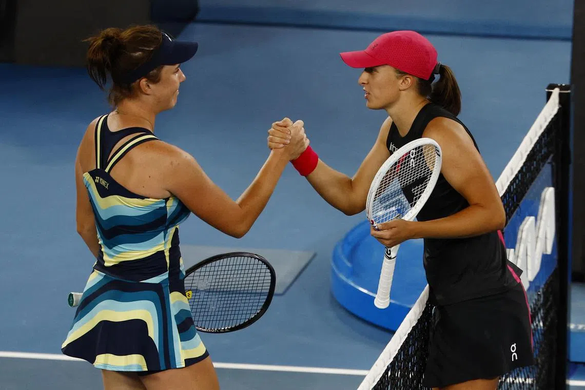 Czech Republic's Linda Noskova shakes hands with Poland's Iga Swiatek after winning their Australian Open third-round clash.