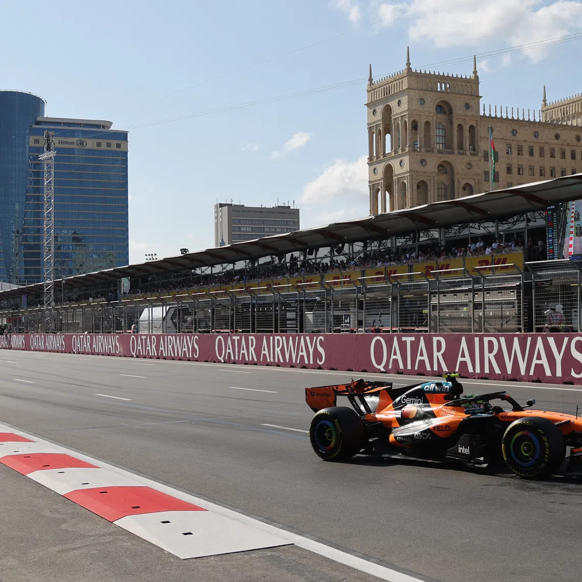 Formula One F1 - Azerbaijan Grand Prix - Baku City Circuit, Baku, Azerbaijan - September 26, 2026 McLaren's Lando Norris in action during the race as Azadliq Square is seen in the background REUTERS/Jakub Porzycki