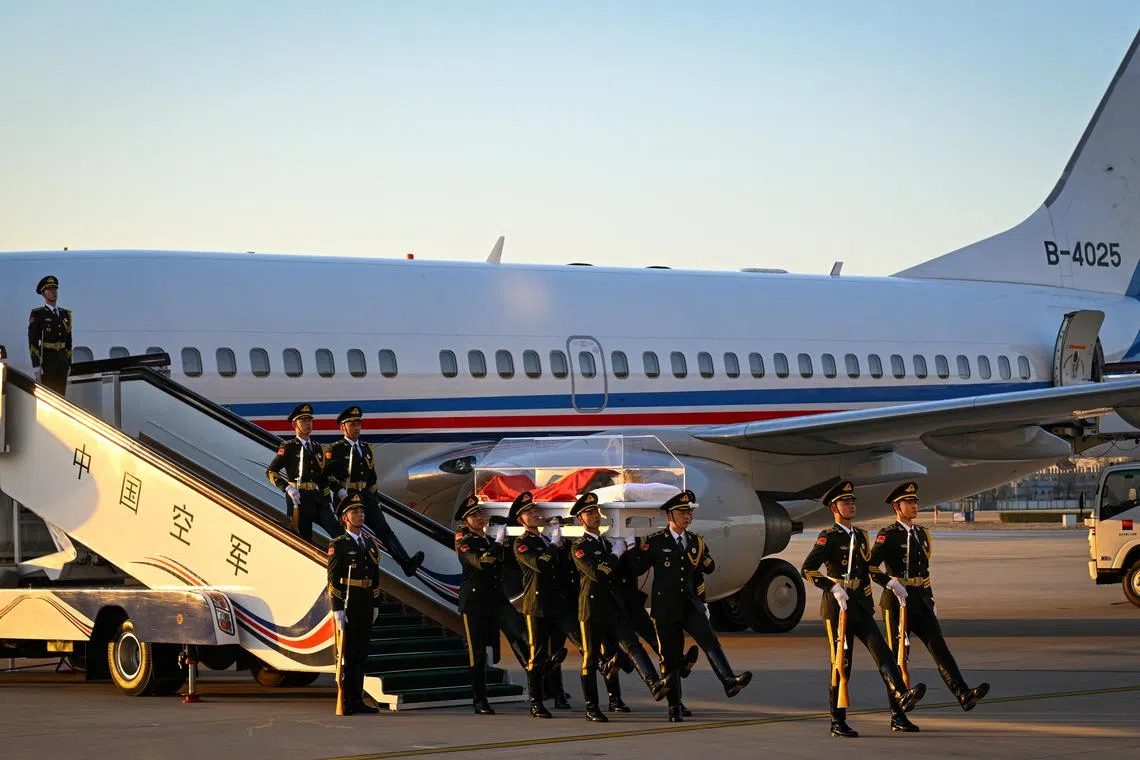 The remains of former Chinese President Jiang Zemin are transferred from Shanghai aboard a special flight, in Beijing, on Dec 1, 2022.