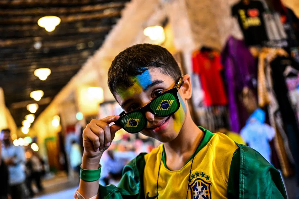 A young Brazil fan posing at the Souq Waqif marketplace in Doha on Nov 19.