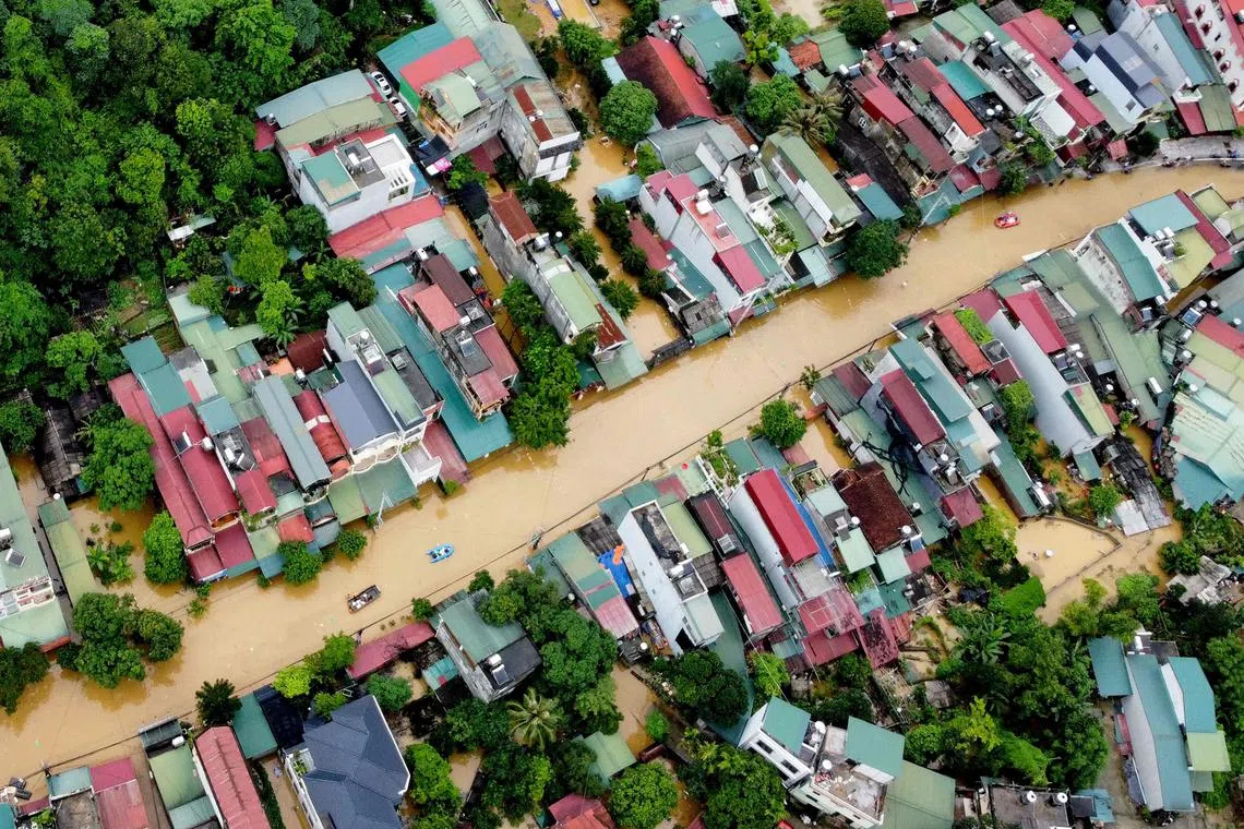 Flood waters submerging buildings after heavy rain in Ha Giang city in northern Vietnam on June 10.