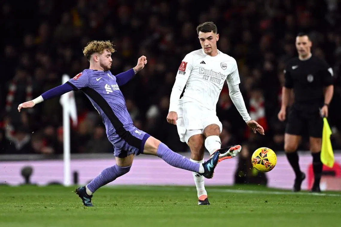 Soccer Football -  FA Cup - Third Round - Arsenal v Liverpool - Emirates Stadium, London, Britain - January 7, 2024 Arsenal's Jakub Kiwior in action with Liverpool's Harvey Elliott REUTERS/Dylan Martinez