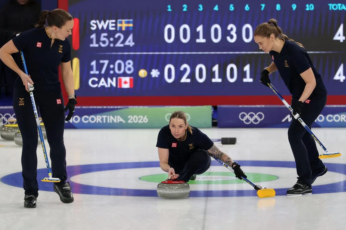 Milano Cortina 2026 Olympics - Curling - Women's Round Robin Session 9 - Sweden vs Canada - Cortina Curling Olympic Stadium, Cortina d'Ampezzo, Italy - February 17, 2026. Sara McManus of Sweden, Agnes Knochenhauer of Sweden and Sofia Scharback of Sweden in action during the match against Canada REUTERS/Issei Kato