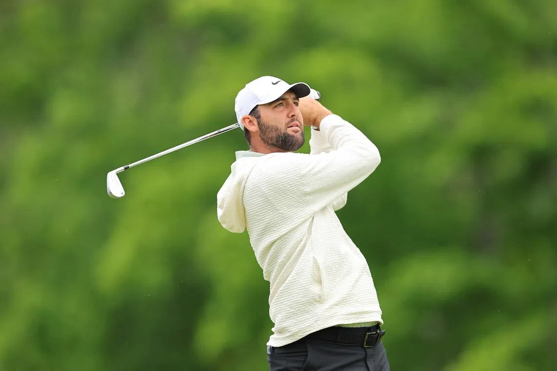 Scottie Scheffler of the United States plays his shot from the eighth tee during a practice round prior to the 2024 PGA Championship at Valhalla Golf Club.