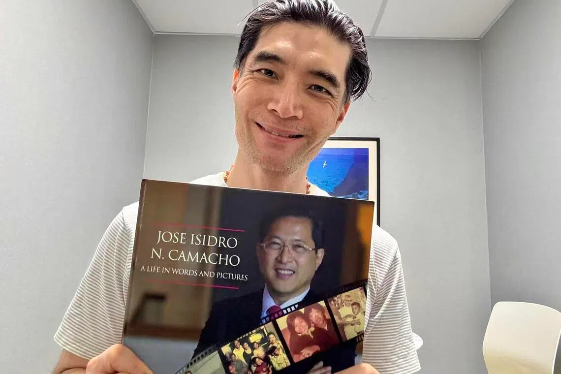 Mr Darrell Ang with a biography of Mr Jose Isidro Camacho, whose story he says brings him closer to the author.