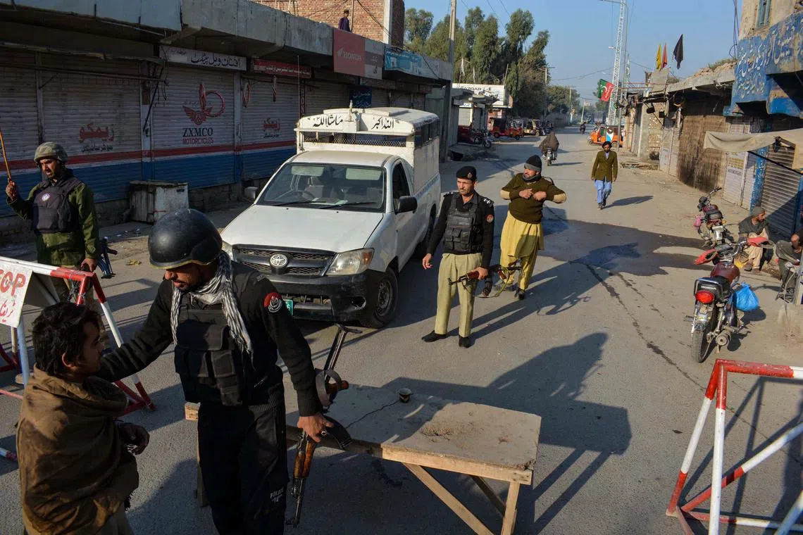 The militants are holding at least eight hostages, including police and military staff.
