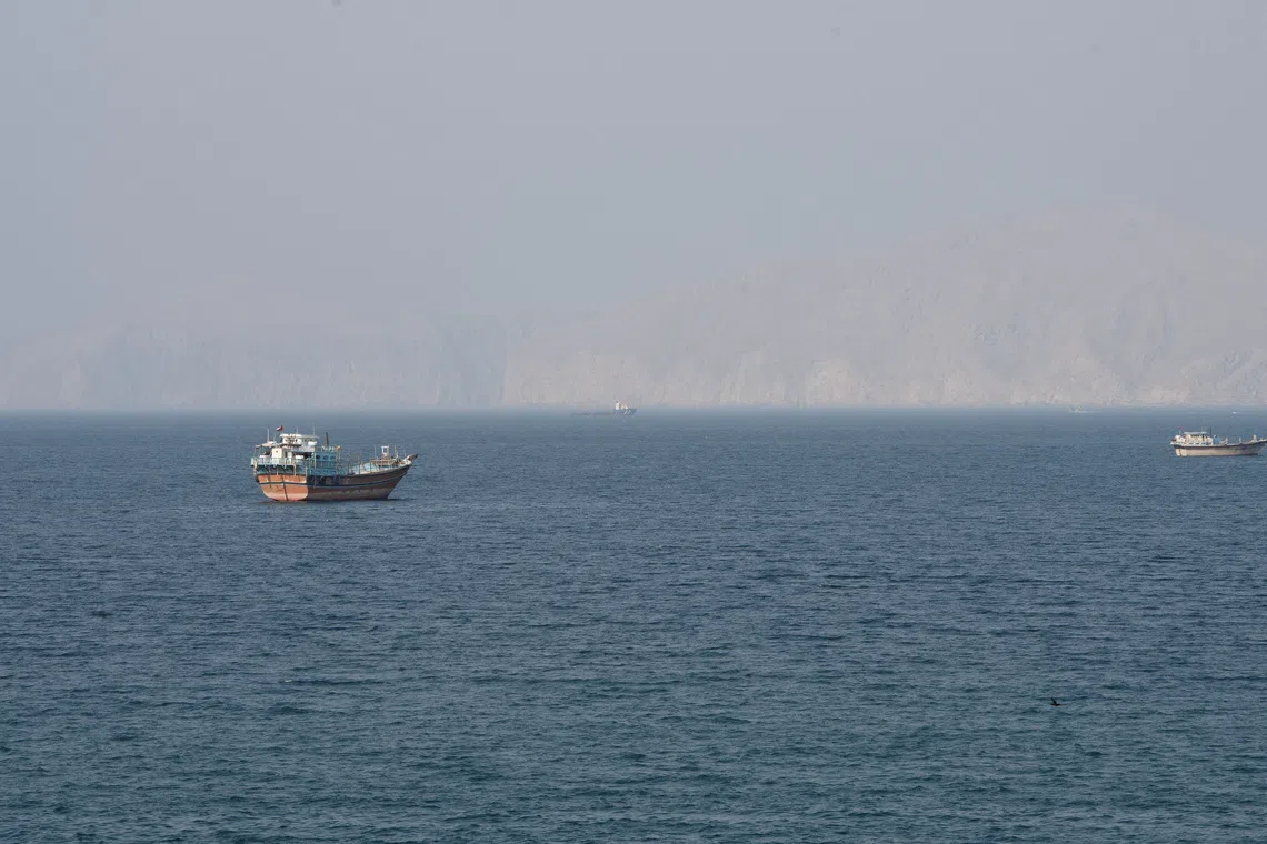 Vessels near the Strait of Hormuz, as seen from Musandam, Oman, August 17, 2026. REUTERS/Stringer