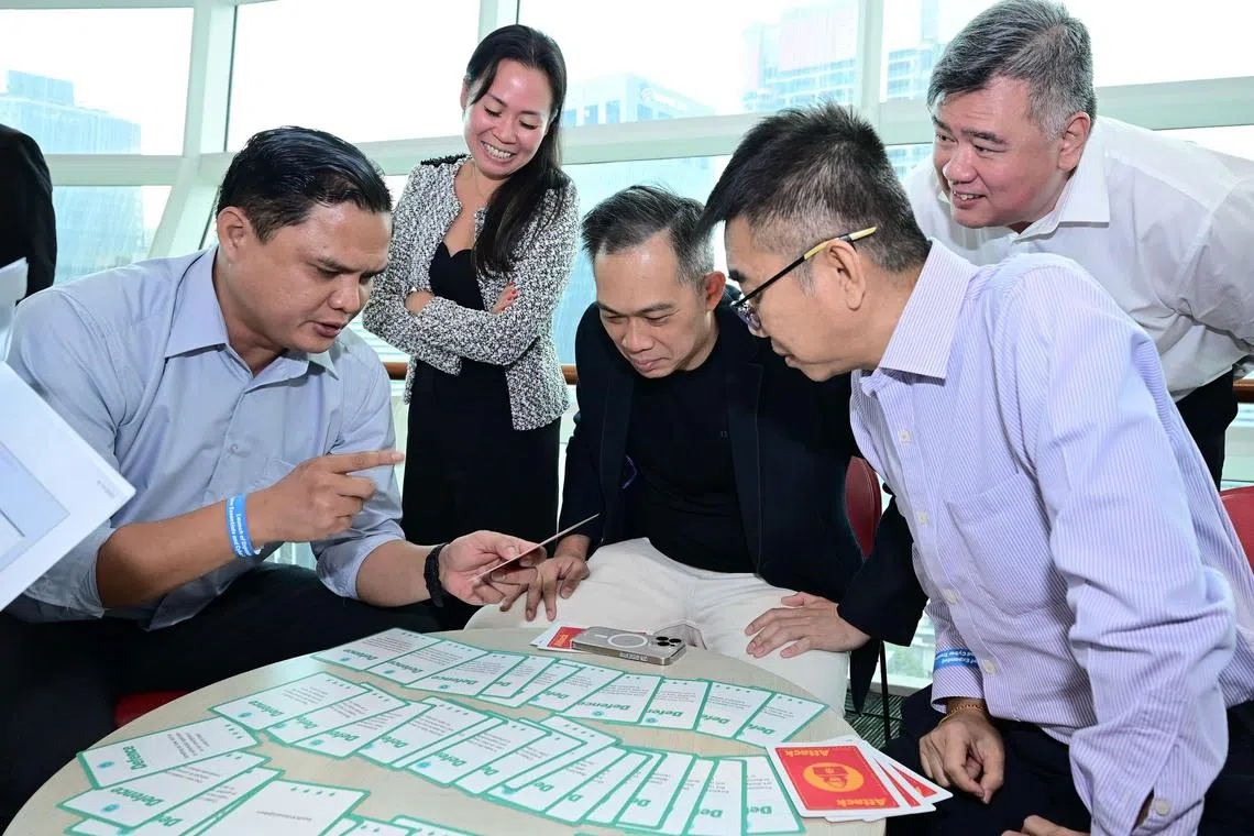 SME executives participating in a simulated cybersecurity exercise at the launch of the expanded Cyber Essentials and Cyber Trust marks on April 15.