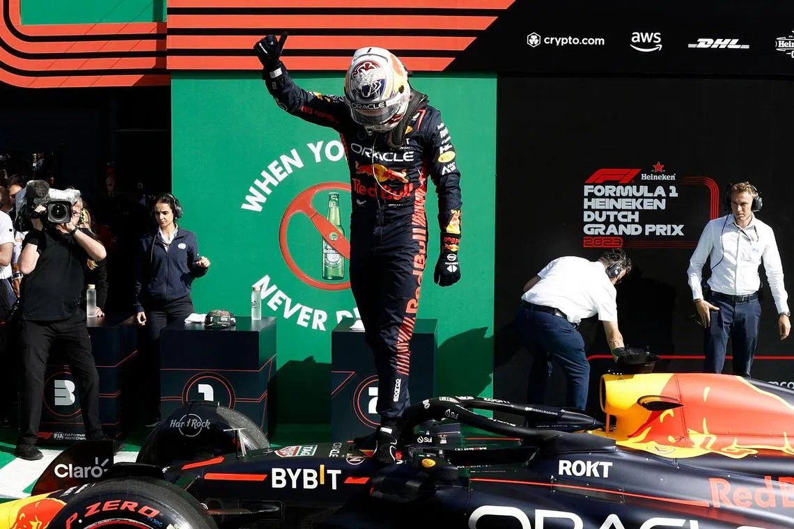 Red Bull's Max Verstappen celebrates taking pole position for the Dutch Grand Prix.
