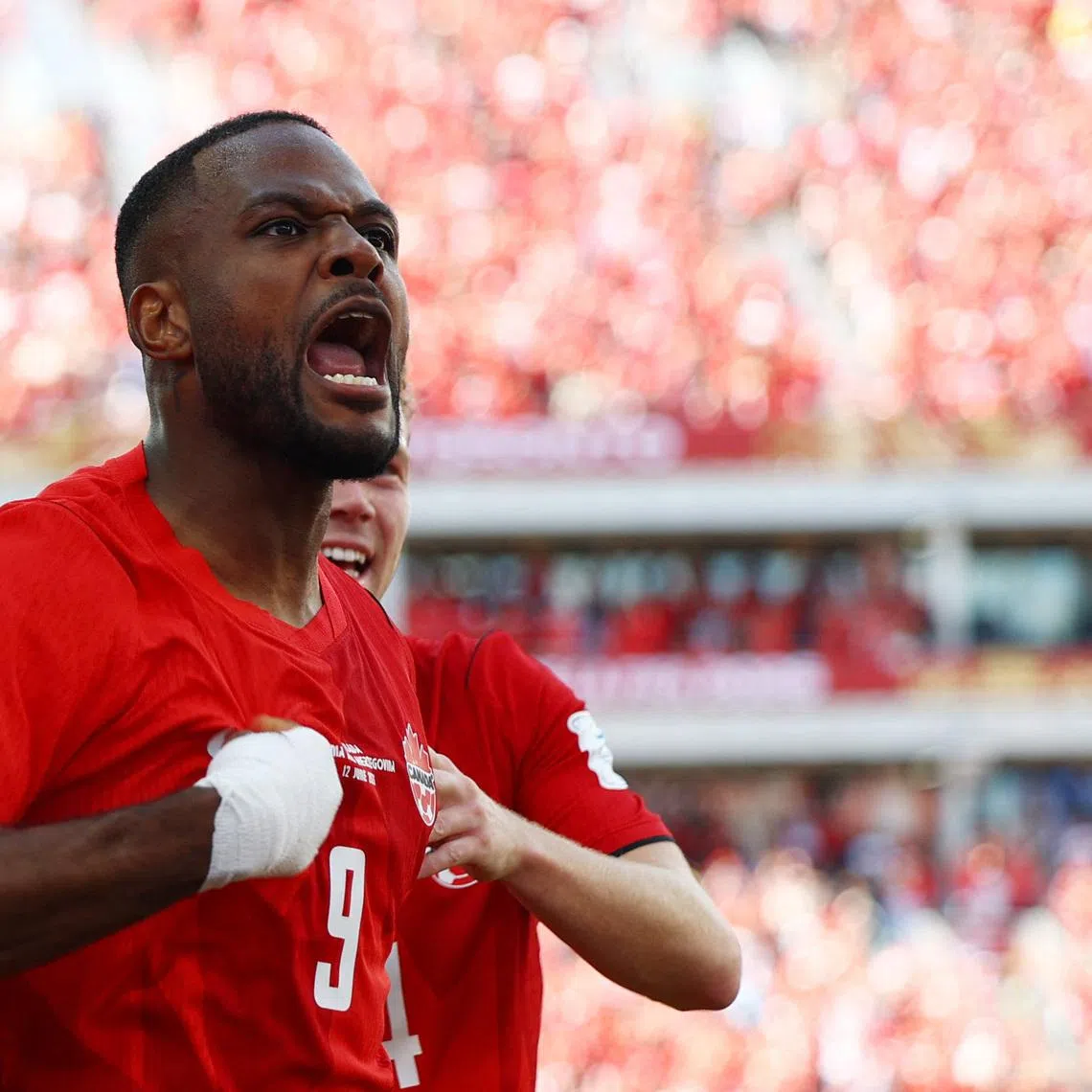 Soccer Football - FIFA World Cup 2026 - Group B - Canada v Bosnia and Herzegovina - Toronto Stadium, Toronto, Canada - June 12, 2026 Canada's Cyle Larin celebrates scoring their first goal REUTERS/Claudia Greco