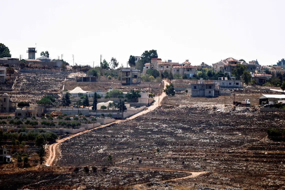 Burnt fields of the border village of Mais al-Jabal and homes destroyed by the Israeli military on Aug 11.