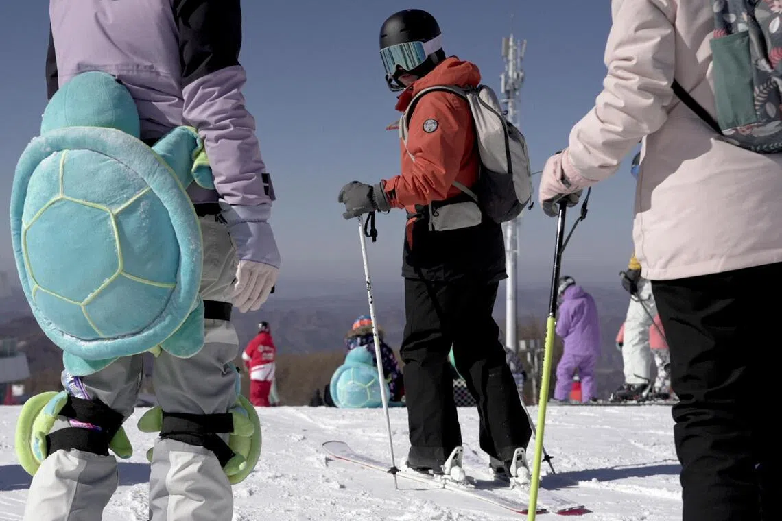 A visitor prepares to ski at Wanlong ski resort in Chongli district, Hebei province, China.