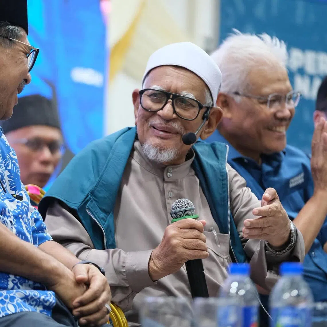 PAS president Hadi Awang (second from left) and Wawasan Negara president Hamzah Zainudin (second from right) at a Perikatan Nasional - Barisan Nasional campaign rally in Negeri Sembilan, July 30, 2026.