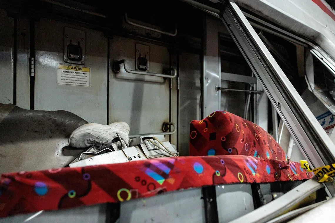 A shoe is seen in a damaged cabin.