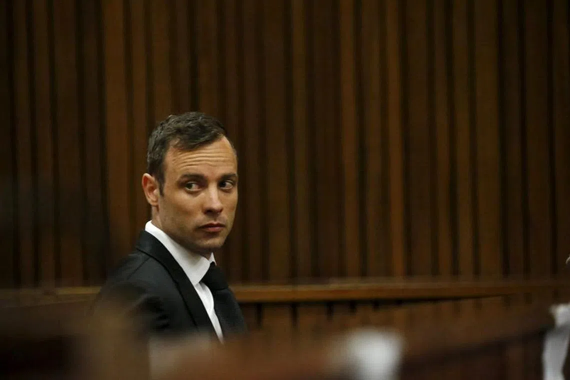FILE PHOTO: Oscar Pistorius sits in the dock at the North Gauteng High Court in Pretoria, South Africa for a bail hearing, December 8, 2015. REUTERS/Siphiwe Sibeko