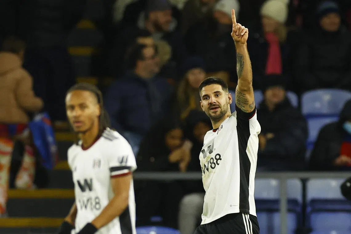 Fulham's Aleksandar Mitrovic celebrates scoring their third goal.