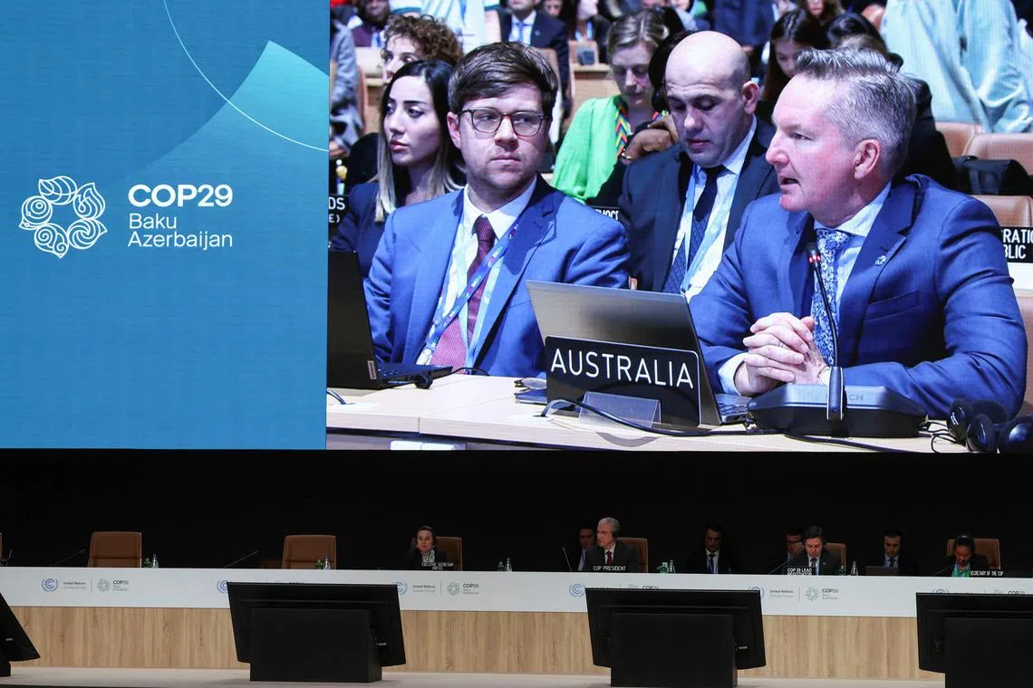 Australia's Minister for Climate Change and Energy Chris Bowen appears onscreen at a plenary session at the COP29 United Nations climate change conference in Baku, Azerbaijan November 21, 2024. REUTERS/Murad Sezer