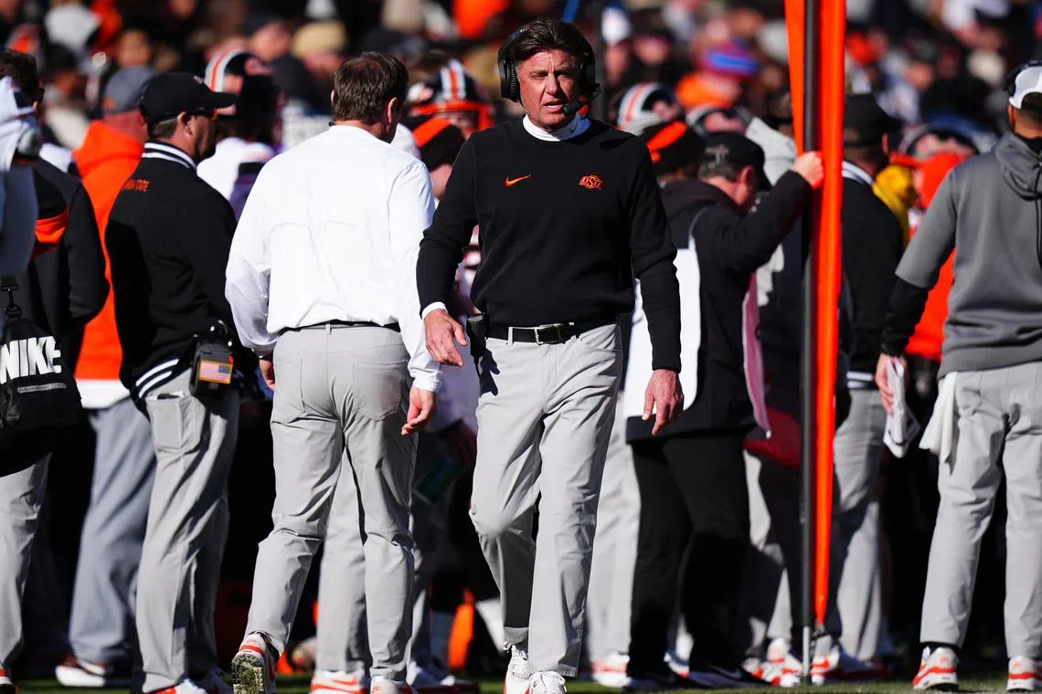 Nov 29, 2024; Boulder, Colorado, USA; Oklahoma State Cowboys head coach Mike Gundy walks the sidelines in the second half against the Colorado Buffaloes at Folsom Field. Ron Chenoy-Imagn Images/File Photo