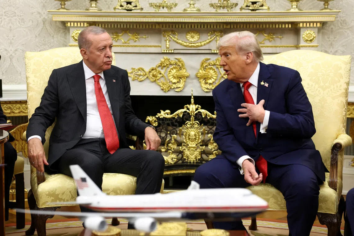 FILE PHOTO: U.S. President Donald Trump and Turkey's President Recep Tayyip Erdogan meet at the White House in Washington, D.C., U.S., September 25, 2025. REUTERS/Kevin Lamarque/File Photo