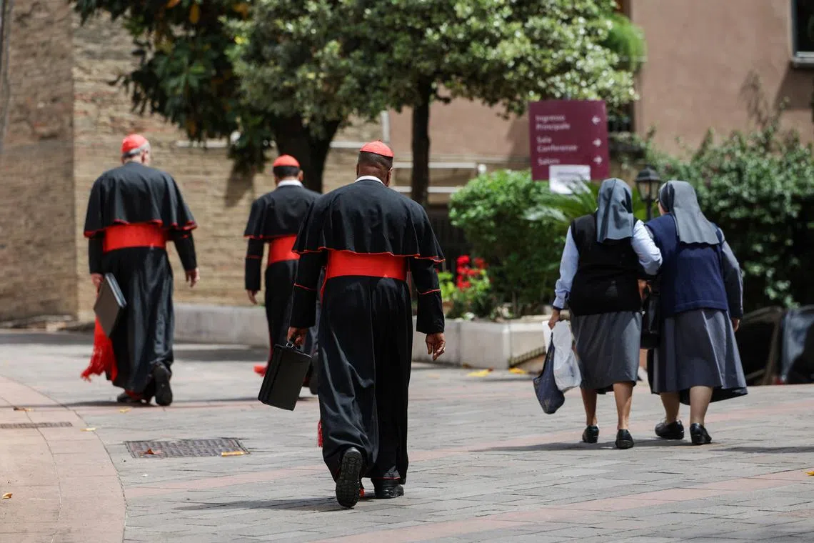 Cardinals walk as they depart a general congregation meeting ahead of the conclave to elect the next pope, as seen from Rome, Italy, May 5, 2025. REUTERS/Murad Sezer