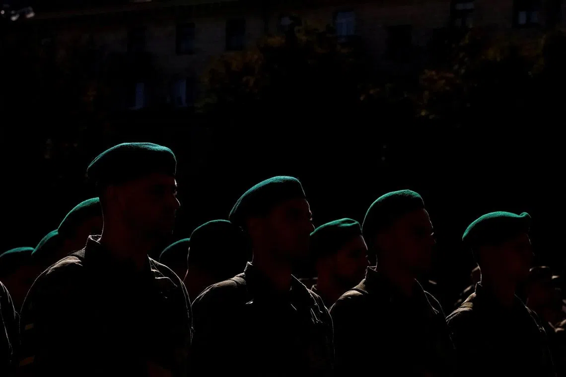 Servicemen attending a ceremony for the Independence Day of Ukraine, amid Russia's invasion of the country, in central Kyiv, Ukraine Aug 24.