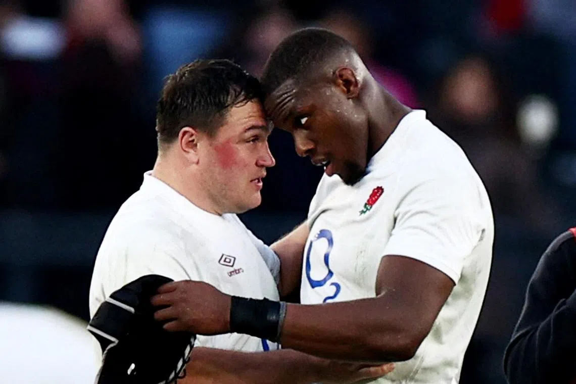 England's Jamie George (left) and Maro Itoje celebrate after a narrow 27-24 win away to Italy on Feb 3.