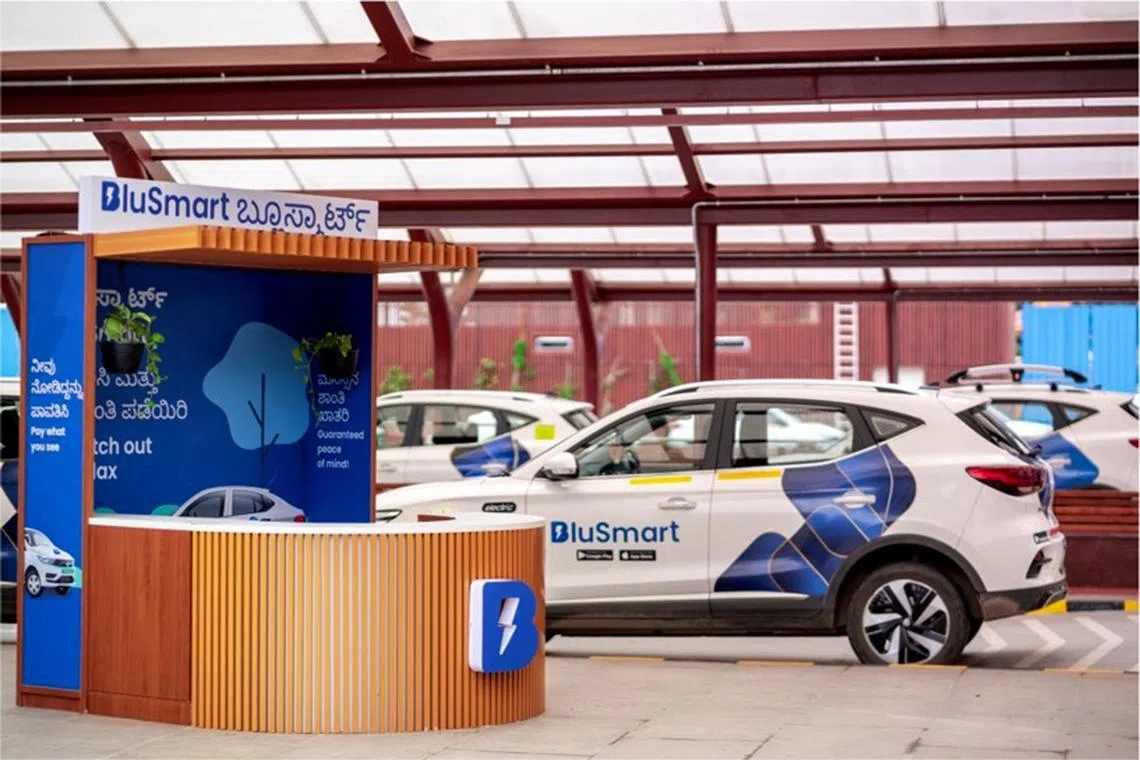 rmev - A BluSmart e-taxi kiosk at Terminal 2 of the Bengaluru International Airport. 

Photo courtesy: BluSmart