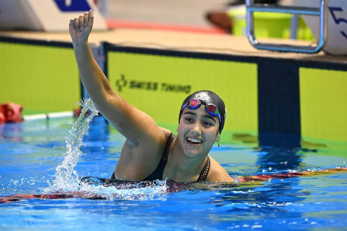 Indonesia's Masniari Wolf celebrates after winning the women's 50m backstroke swimming final at the 32nd Southeast Asian Games (SEA Games) in Phnom Penh on May 7, 2023. (Photo by Tang Chhin Sothy / AFP)