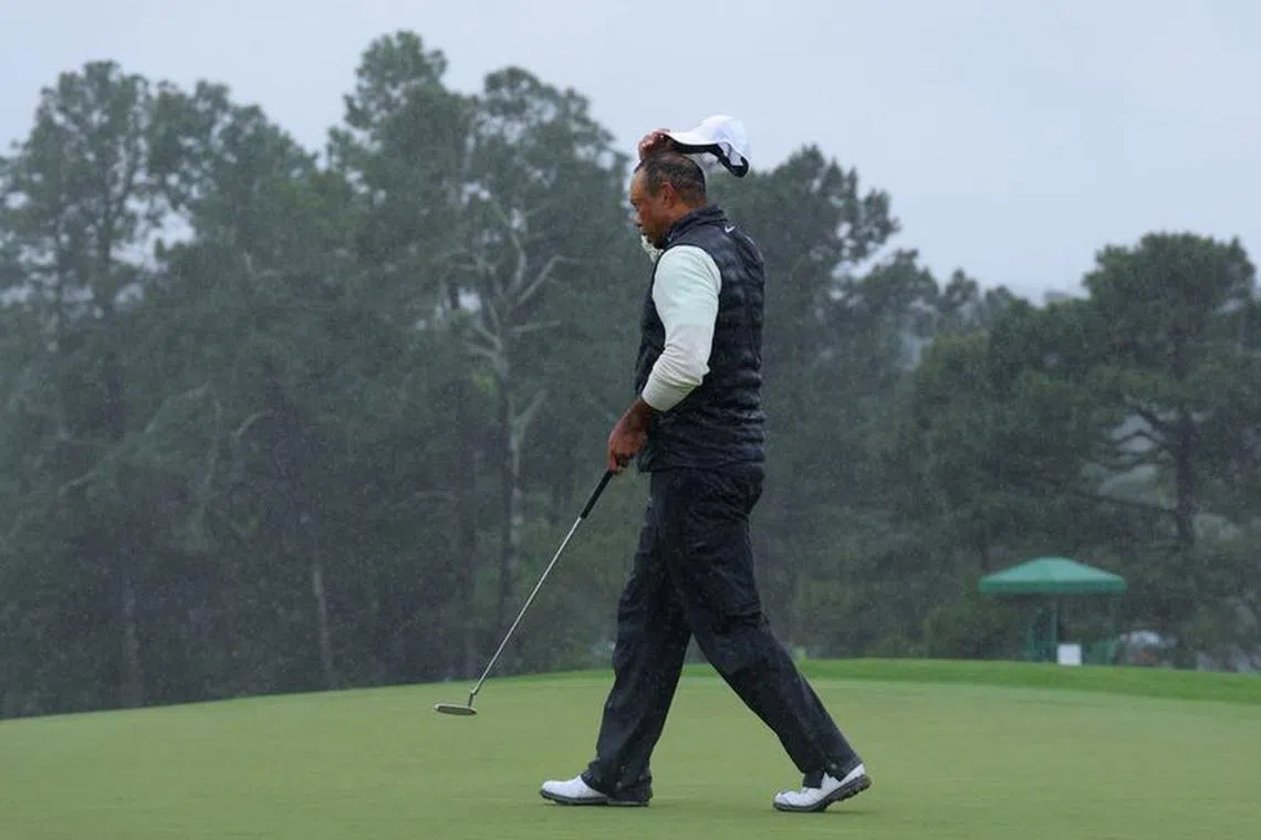 Golf - The Masters - Augusta National Golf Club - Augusta, Georgia, U.S. - April 8, 2023 Tiger Woods of the U.S. acknowledges the crowd on the 18th green after completing his second round REUTERS/Brian Snyder/file photo