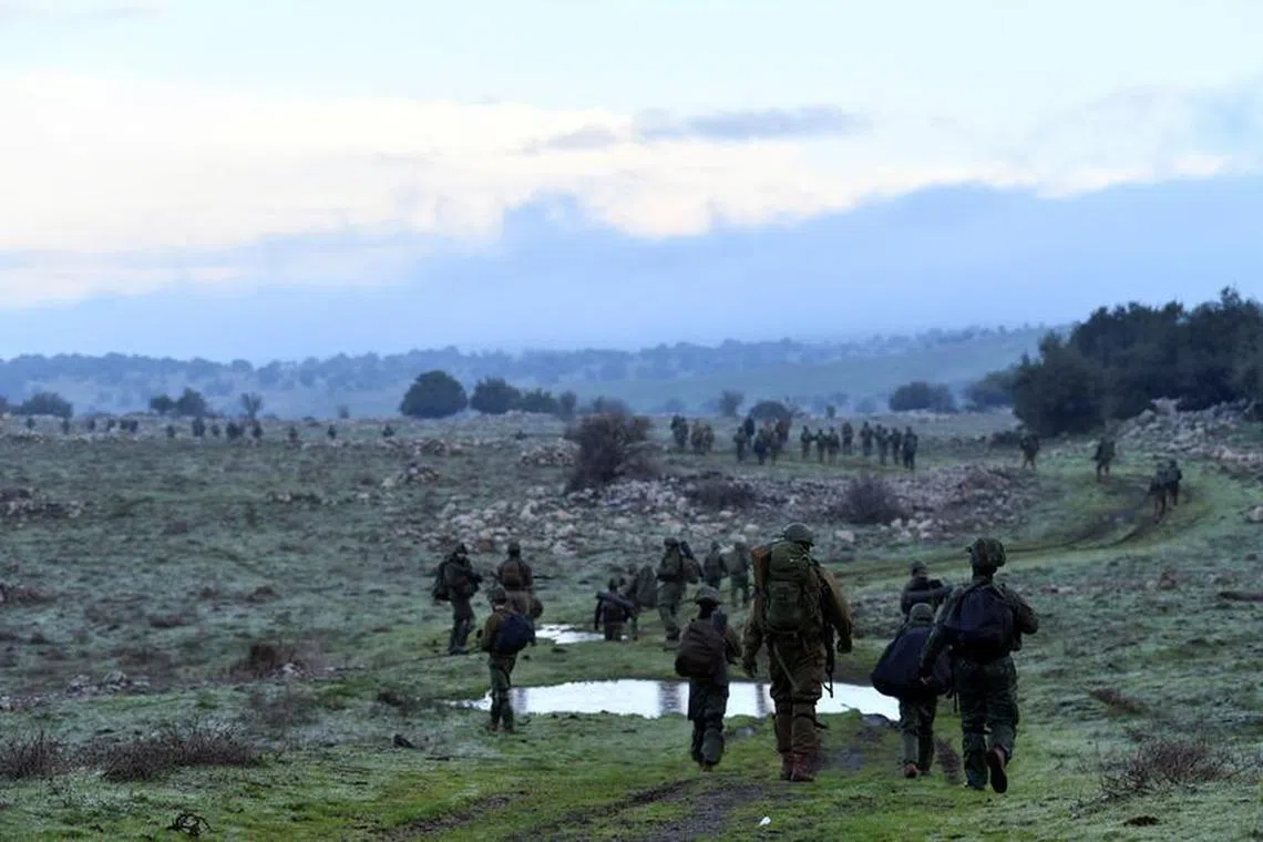 Israeli soldiers take part in training session near the Israel border with Syria at the Israeli-occupied Golan Heights, February 1, 2024. REUTERS/Gil Eliyahu/File Photo