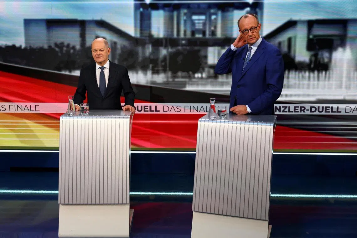 German Chancellor Olaf Scholz (left) and conservative CDU rival Friedrich Merz taking part in a TV debate in Berlin on Feb 19, ahead of Germany's Feb 23 election.