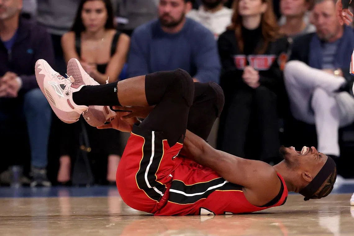 Jimmy Butler of the Miami Heat in pain after falling during Game 1 of the NBA Eastern Conference play-off semi-finals against the New York Knicks.