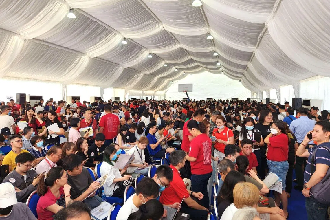 Prospective homebuyers of J’den waiting for their numbers to be called during the live balloting held on Nov 11, 2023.