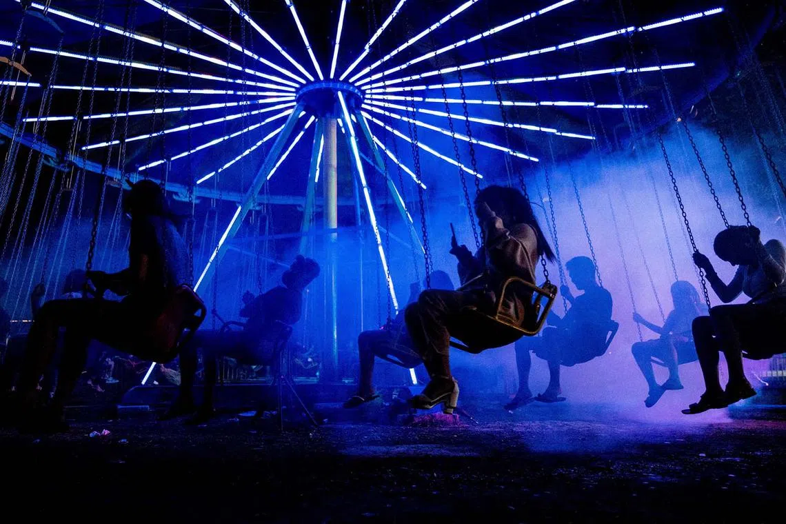 People enjoy a swing ride at a Christmas carnival in Marikina City, Metro Manila, Philippines, December 20, 2022. REUTERS/Lisa Marie David TPX IMAGES OF THE DAY