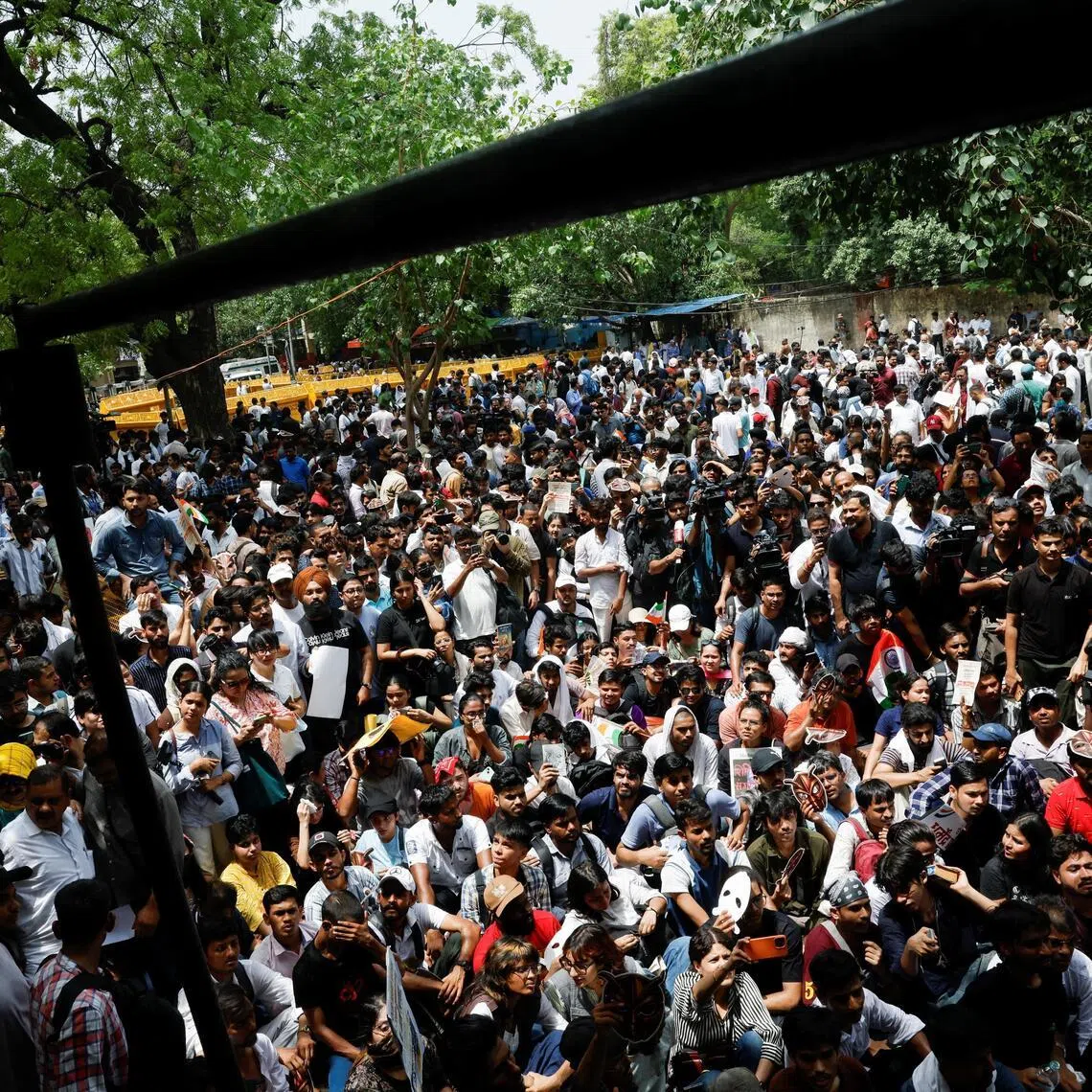 Supporters of the Cockroach Janta Party (CJP) gather during a sit-in protest demanding the resignation of Indian Education Minister Dharmendra Pradhan, in New Delhi on June 6.