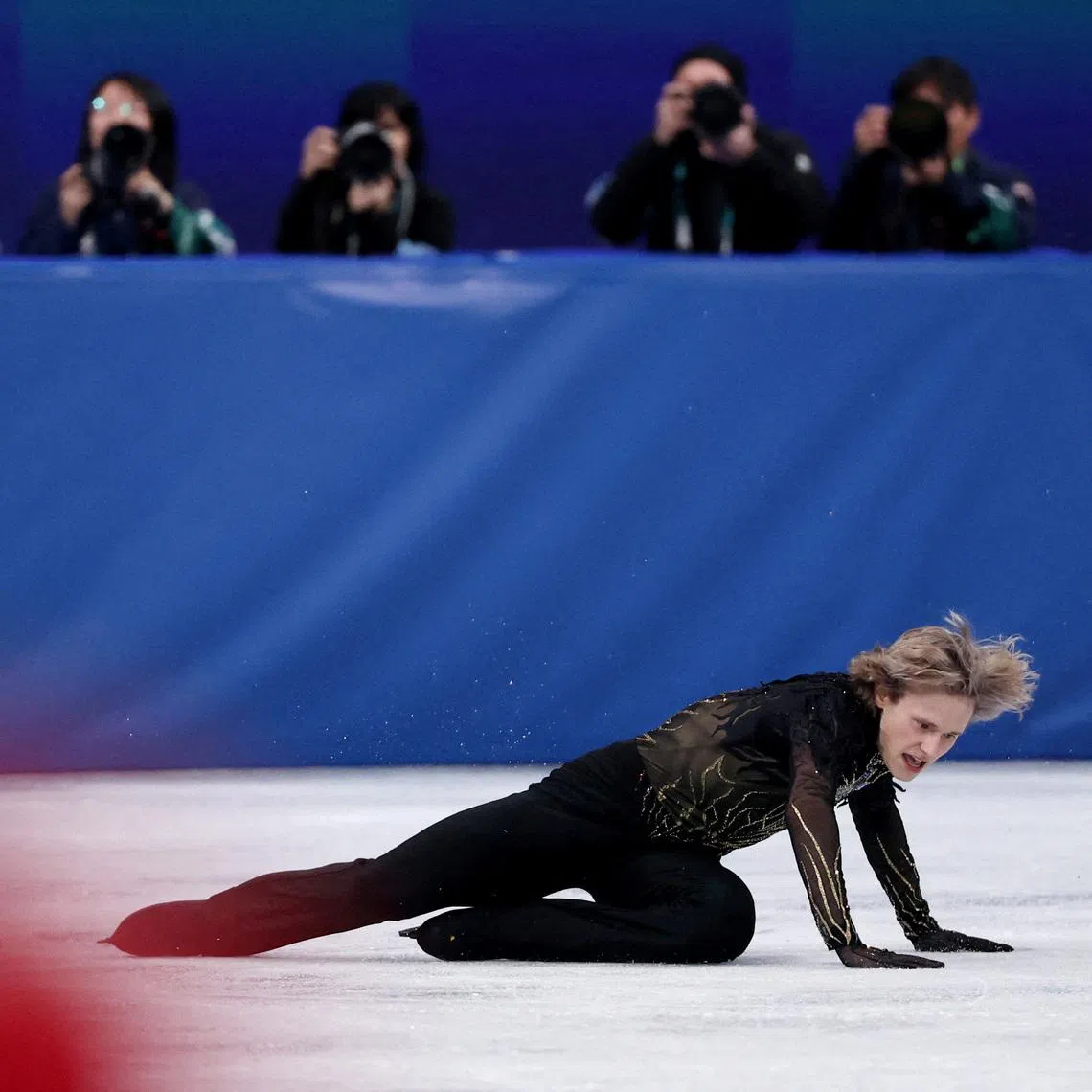 FILE PHOTO: Milano Cortina 2026 Olympics - Figure Skating - Men Single Skating - Free Skating - Milano Ice Skating Arena, Milan, Italy - February 13, 2026. Ilia Malinin of United States falls during the Free Skating REUTERS/Yara Nardi/File Photo