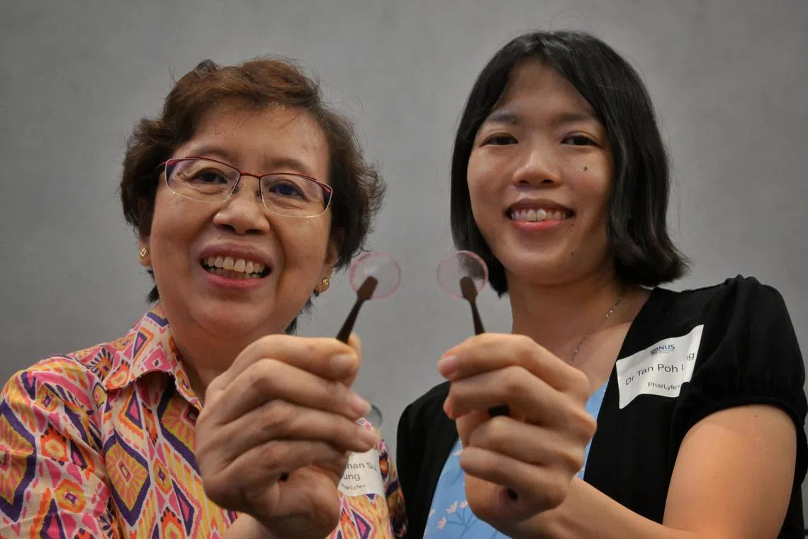 Slug: mhgrip28
ST PHOTO: Chong Jun Liang

From left: Associate Professor Chan Sui Yung and Dr Tan Poh Leng from PharLyfe  each show a sample of buccal film at the NUS Graduate Research Programme (GRIP) Lift-Off Day 2023 on June 28, 2023. 

****

14 NUS teams will be presenting their solutions at Lift-Off Day on 28 June 2023 to an audience comprising industry, venture capitalists and incubators in a bid to secure funding as well as partnership and collaboration opportunities.