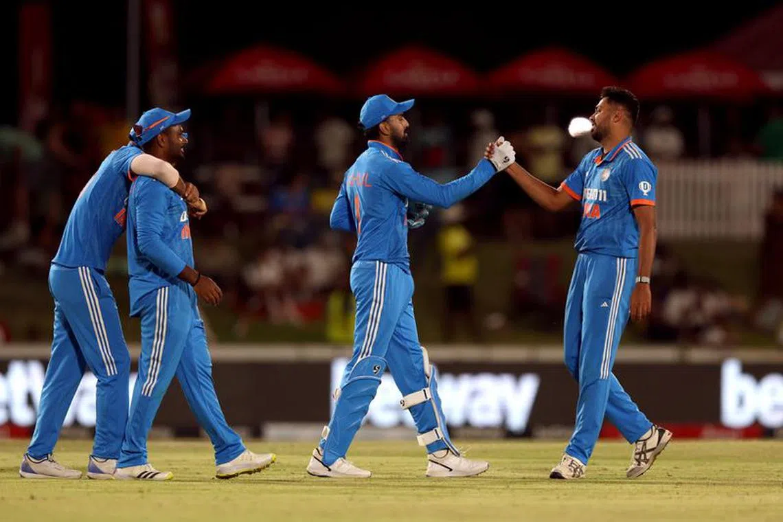 Cricket - Third One Day International - South Africa v India - Boland Park, Paarl, South Africa - December 21, 2023 India's Avesh Khan and KL Rahul celebrate winning their match against South Africa REUTERS/Esa Alexander/File Photo