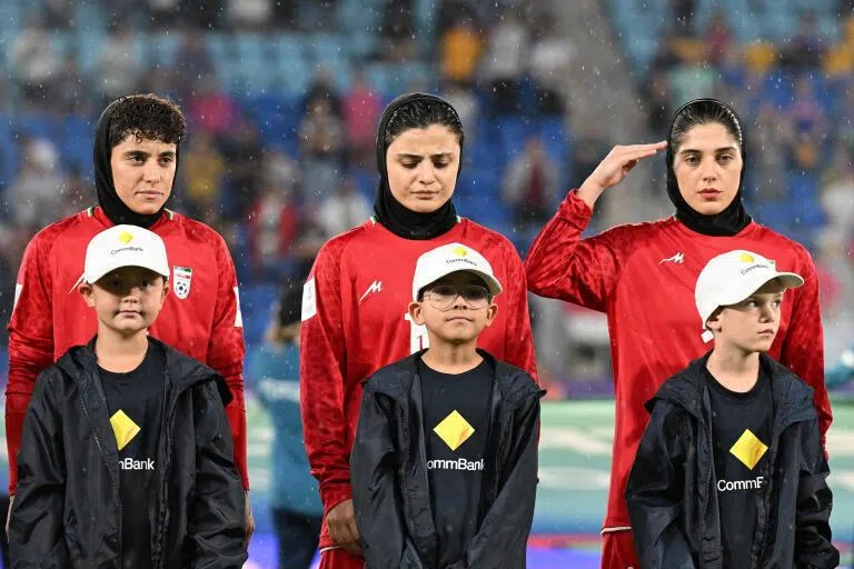 Iran players Atefeh Imani, Fatemeh Pasandideh and Sana Sadeghi react during their national anthem during the AFC Women's Asian Cup Group A match between Iran and the Philippines on the Gold Coast, Australia, on March 8.