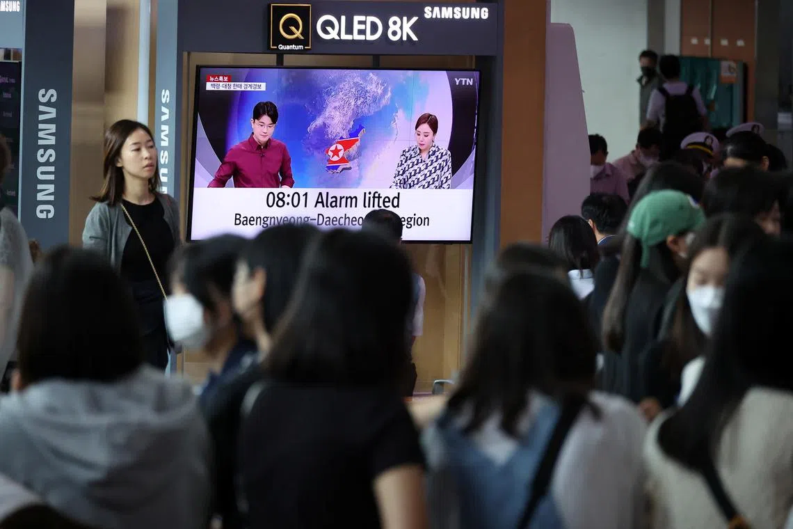 People watch a news report on North Korea firing what it called a space satellite toward the south, in Seoul, South Korea, on May 31.