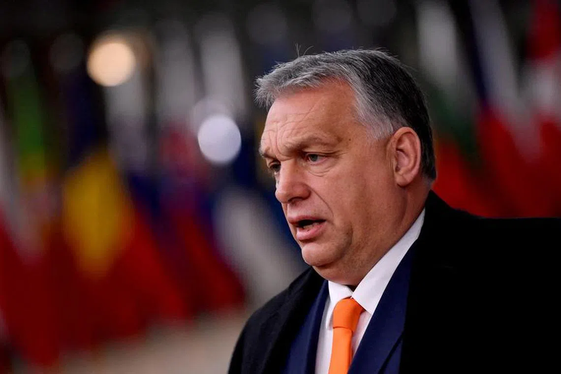 FILE PHOTO: Hungarian Prime Minister Viktor Orban speaks as he arrives for an EU summit in Brussels, Belgium December 10, 2020. John Thys/Pool via REUTERS/File Photo/