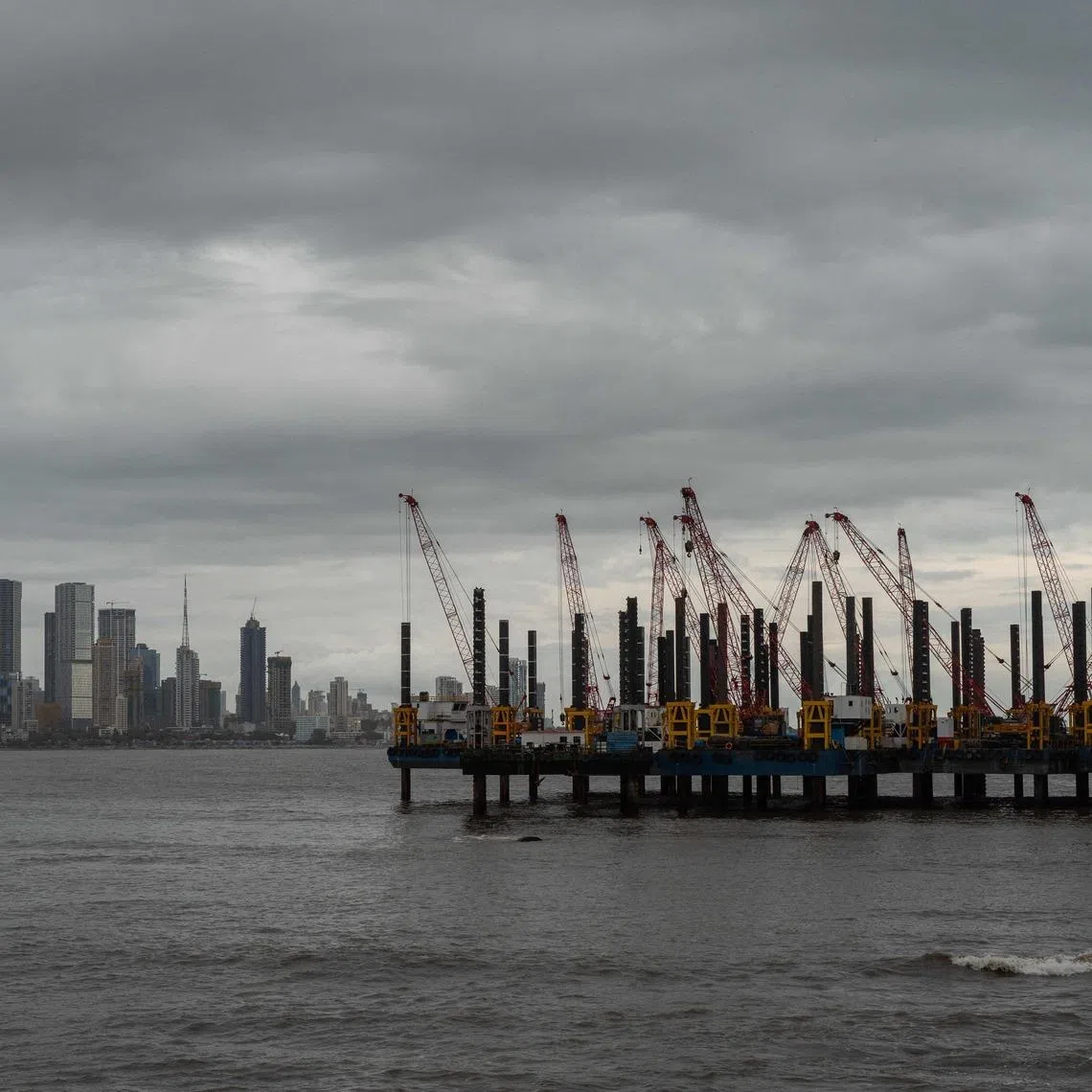 Cranes installed near the Bandra-Worli Sea Link bridge in Mumbai on June 28. The death of an Indian seafarer in Venezuela has sparked demands for an investigation after an autopsy in Uttar Pradesh, India, reportedly found all of his major internal organs missing.