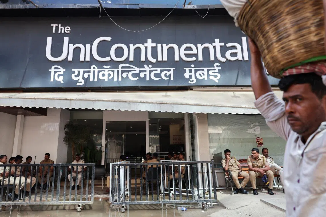 Police officers sit outside The Habitat, a studio where Kunal Kamra, a stand-up comedian, performed  following which the studio was ransacked by the supporters of Eknath Shinde, Deputy Chief Minister of Maharashtra, in Mumbai, India, March 26, 2025. REUTERS/Francis Mascarenhas