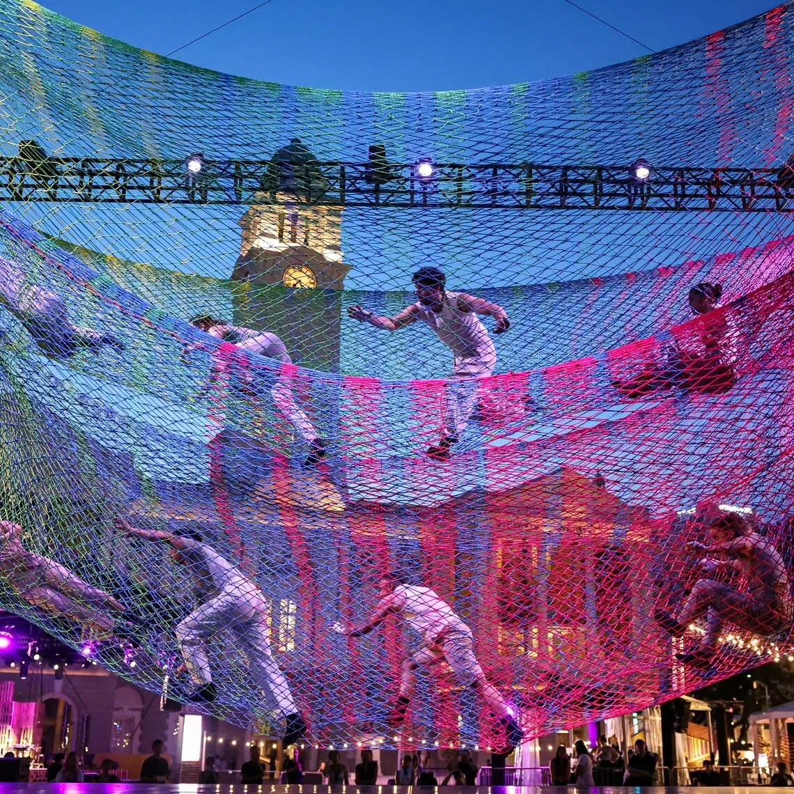 Performers suspended above the ground inside a giant aerial net during a rehearsal for Noli Timere at Empress Lawn, Singapore, on May 14, during the media preview of the Singapore International Festival of Arts (SIFA), that will showcase local and international theatre, dance, music and multidisciplinary works from May 15 to 30. 