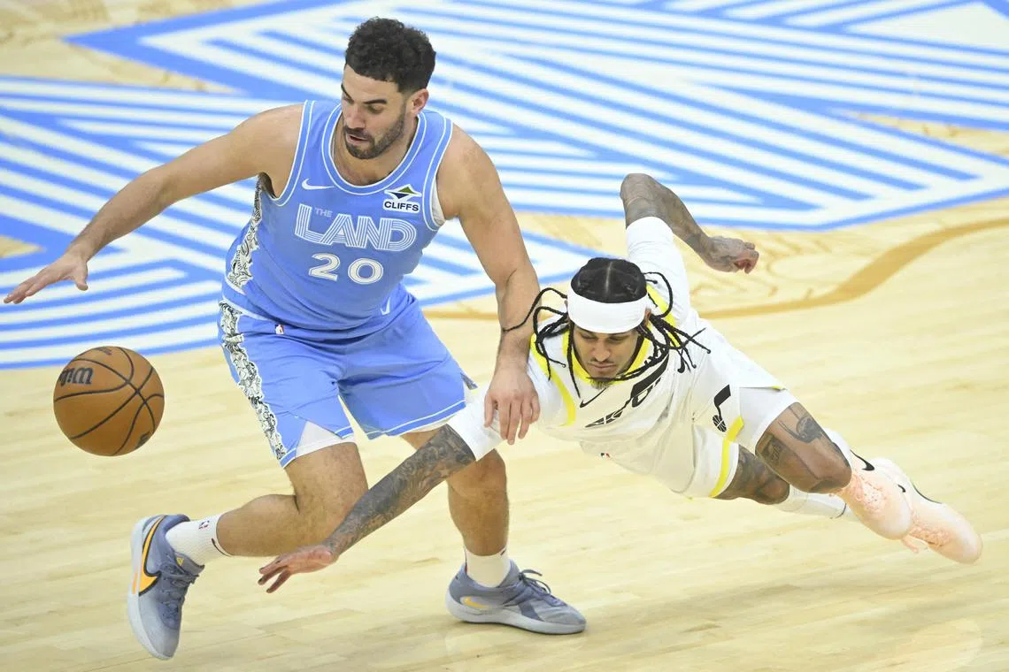 Cleveland Cavaliers forward Georges Niang steals the ball from Utah Jazz guard Jordan Clarkson in the fourth quarter at Rocket Mortgage FieldHouse.