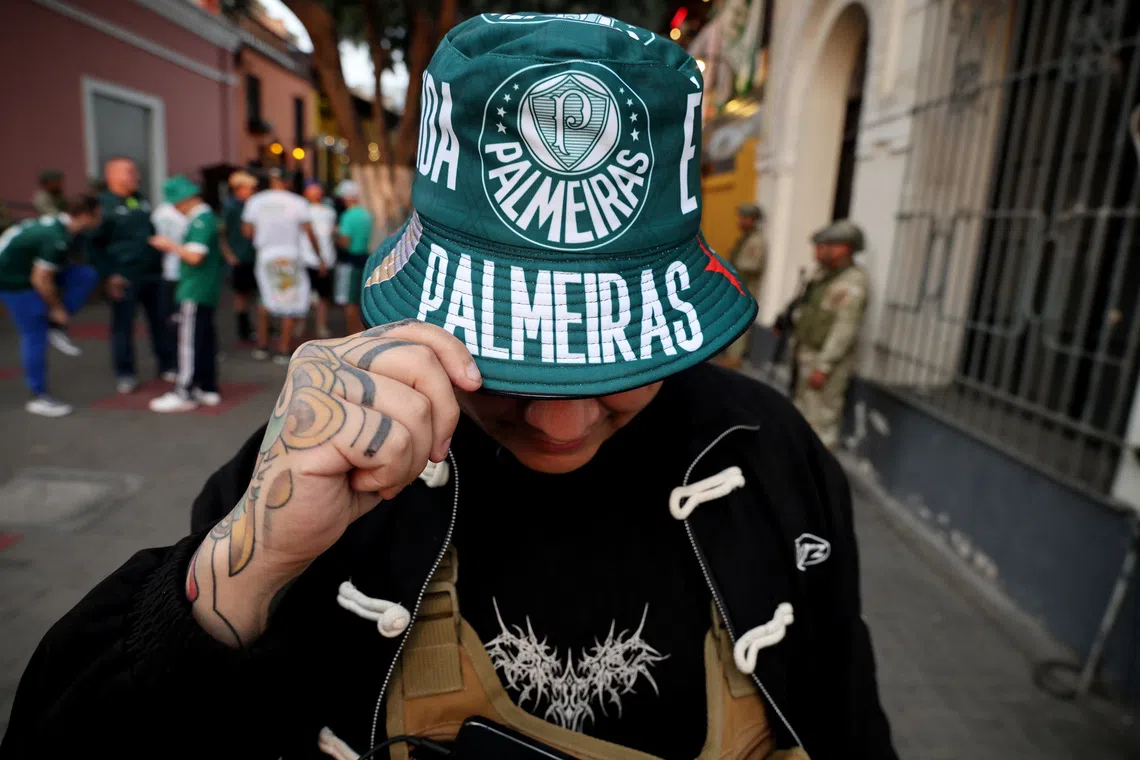 Soccer Football - Copa Libertadores - Final - Fans in the streets of Lima ahead of the final - Lima, Peru - November 27, 2025 Palmeiras fans celebrate in Pasaje Sanchez Carrion ahead of the final REUTERS/Sebastian Castaneda